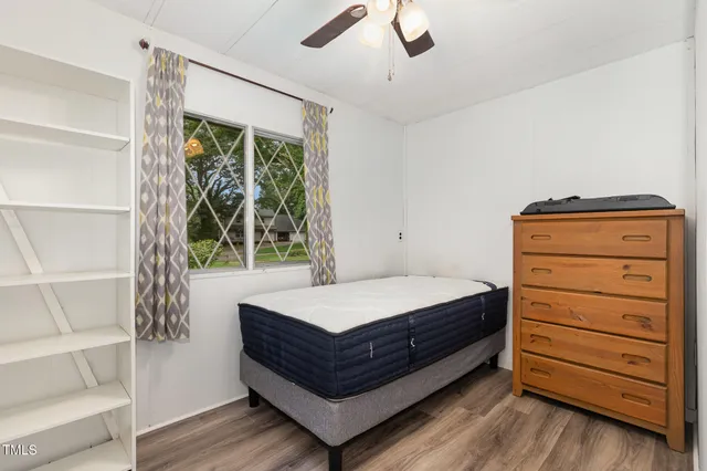 a room with a bed and a window