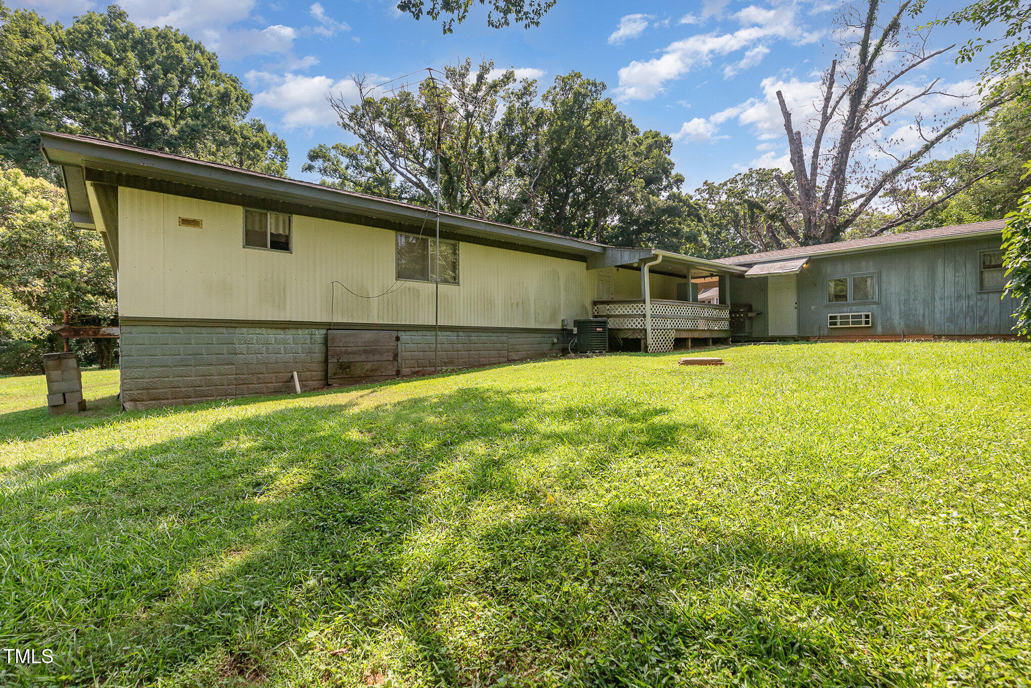 5840 Fayetteville Road Raleigh, NC 27603 - Photo 34 of 40 a backyard of a house with yard and garage