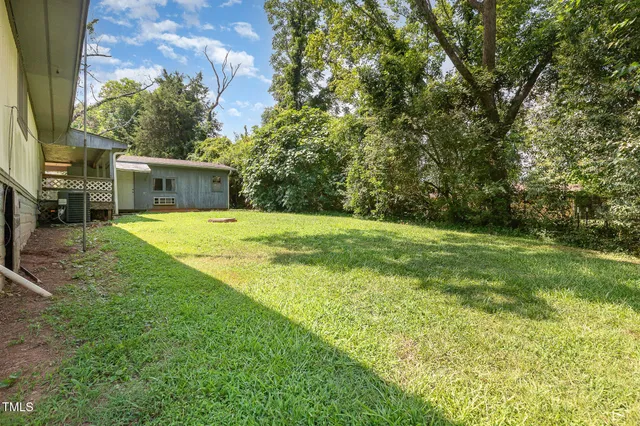 a swimming pool with trees in the background
