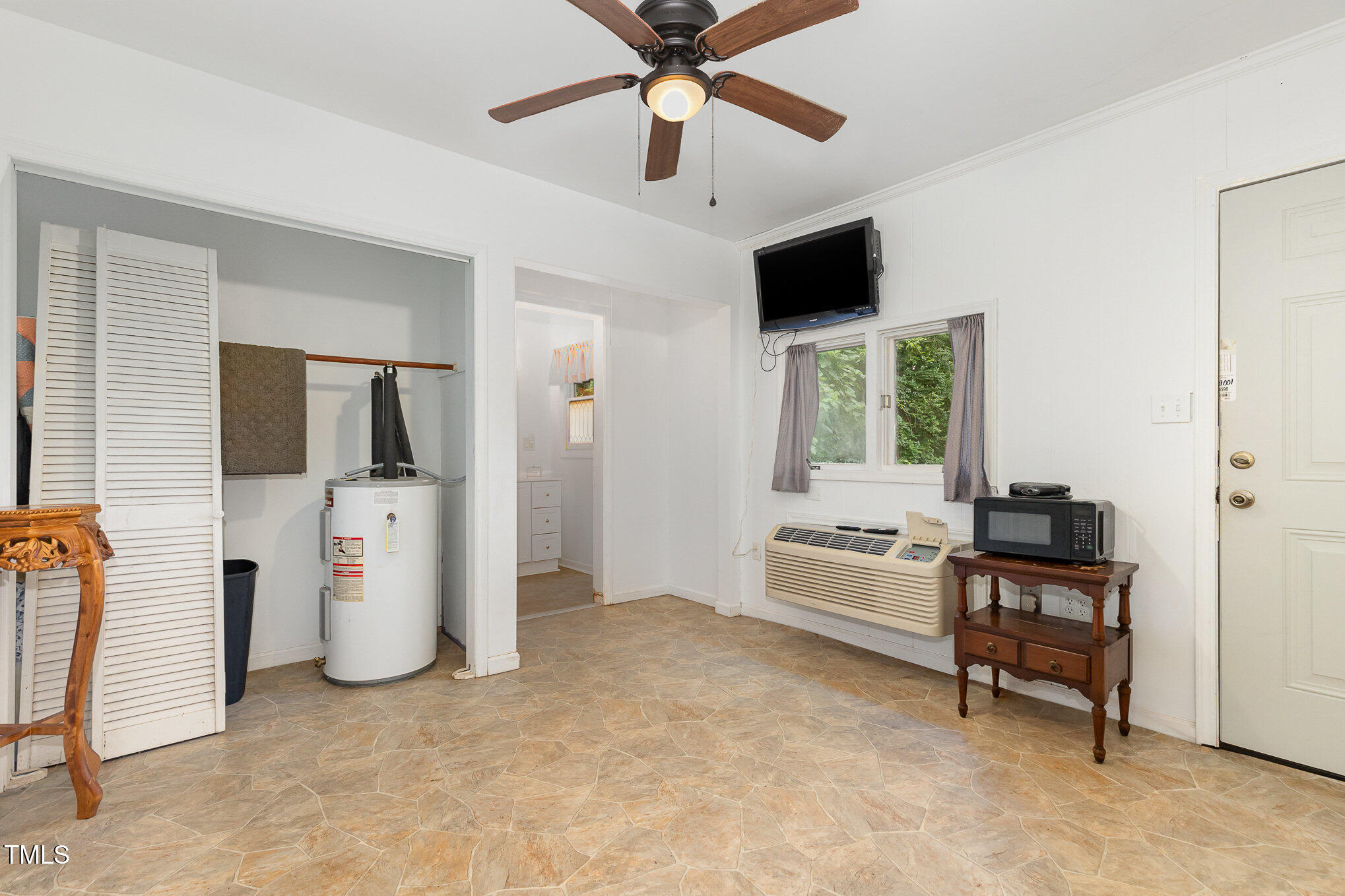 5840 Fayetteville Road Raleigh, NC 27603 - Photo 39 of 40 a living room with furniture and a flat screen tv