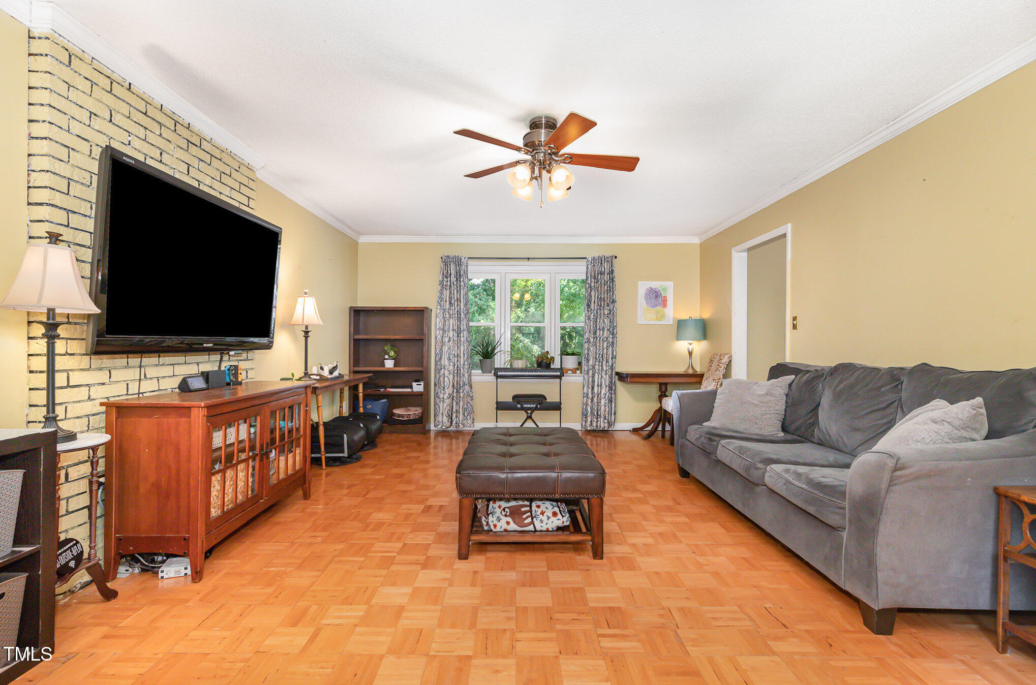 5840 Fayetteville Road Raleigh, NC 27603 - Photo 4 of 40 a living room with furniture and a flat screen tv