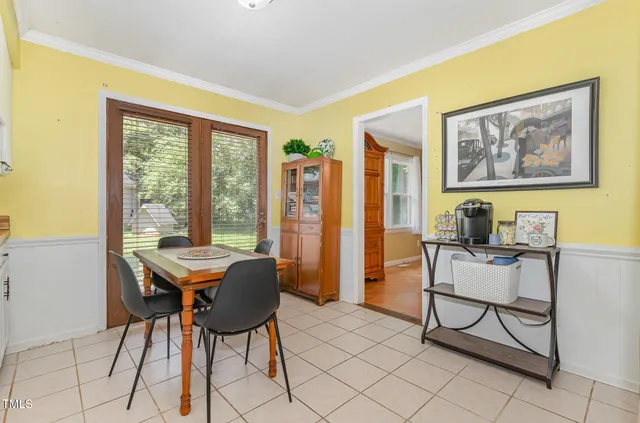 a view of a livingroom with furniture and a window