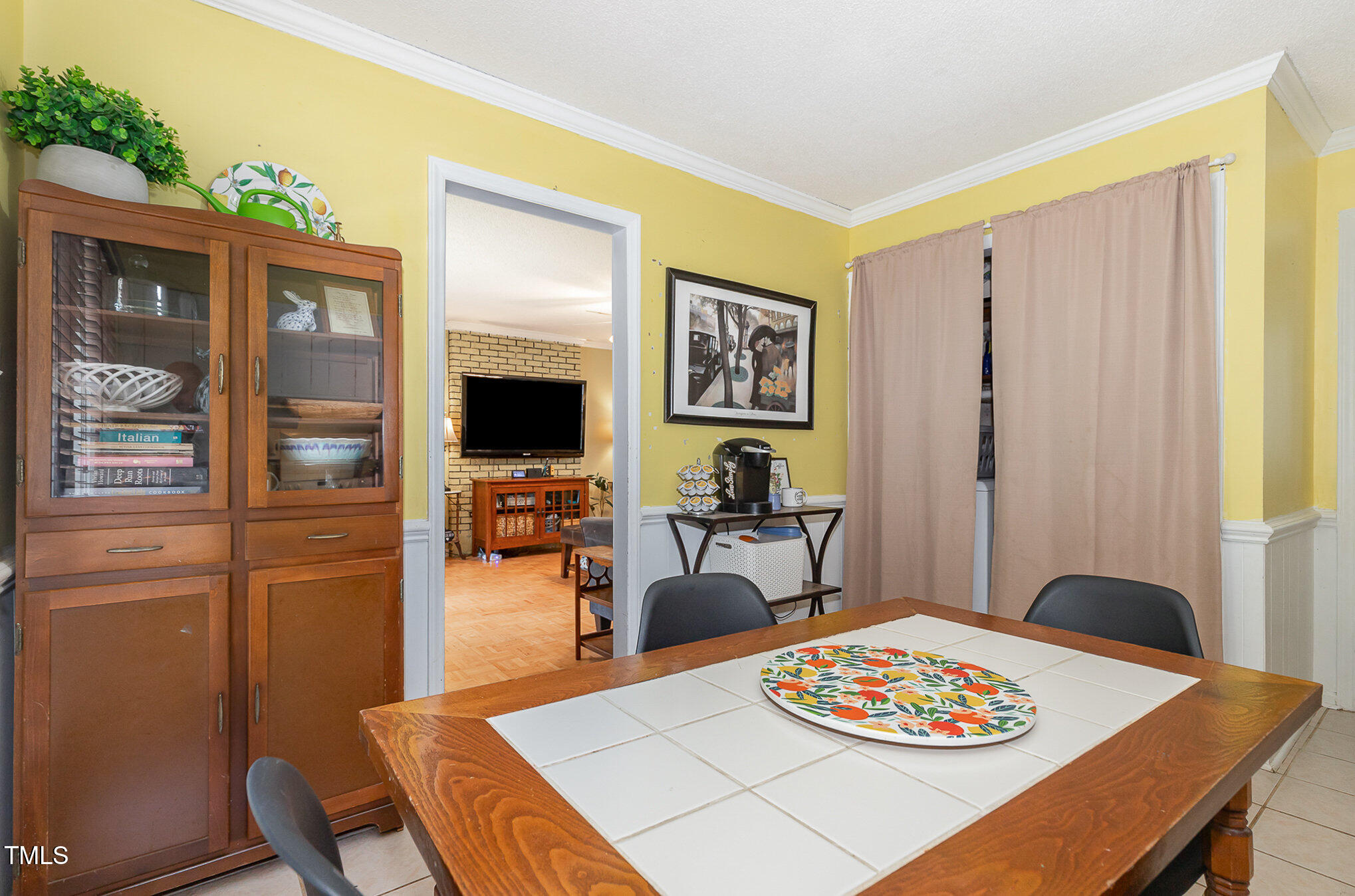 5840 Fayetteville Road Raleigh, NC 27603 - Photo 7 of 40 a living room with furniture and a flat screen tv