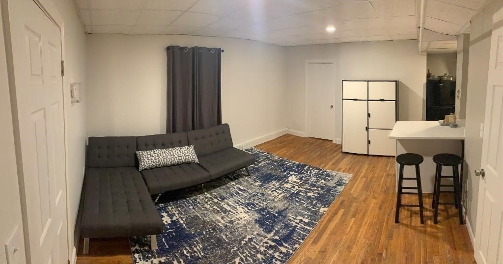 15 Aberdeen Street, Unit AB Boston, MA 02215 - Photo 2 of 7 a living room with furniture and a fireplace
