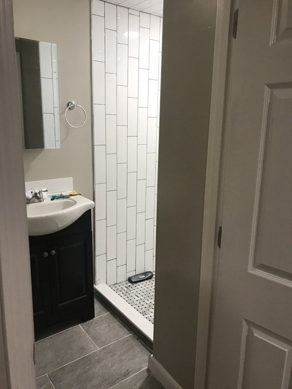 15 Aberdeen Street, Unit AB Boston, MA 02215 - Photo 5 of 7 a bathroom with a sink and a mirror