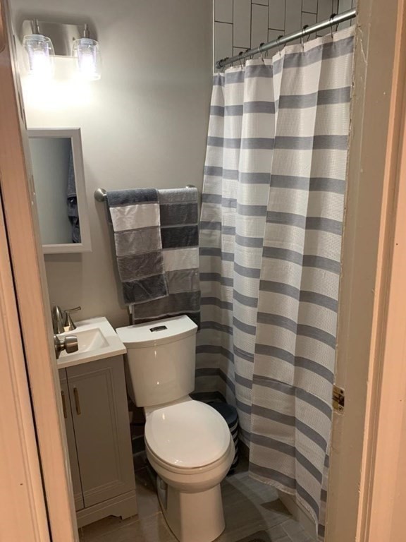 15 Aberdeen Street, Unit AB Boston, MA 02215 - Photo 7 of 7 a bathroom with a toilet and a shower curtain