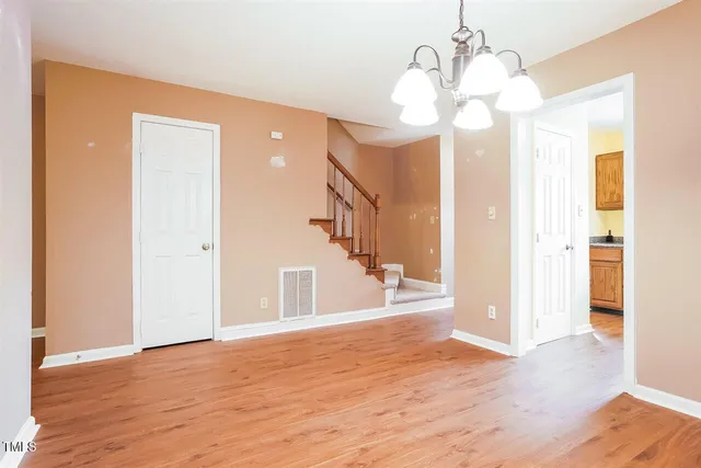 a view of a livingroom with wooden floor