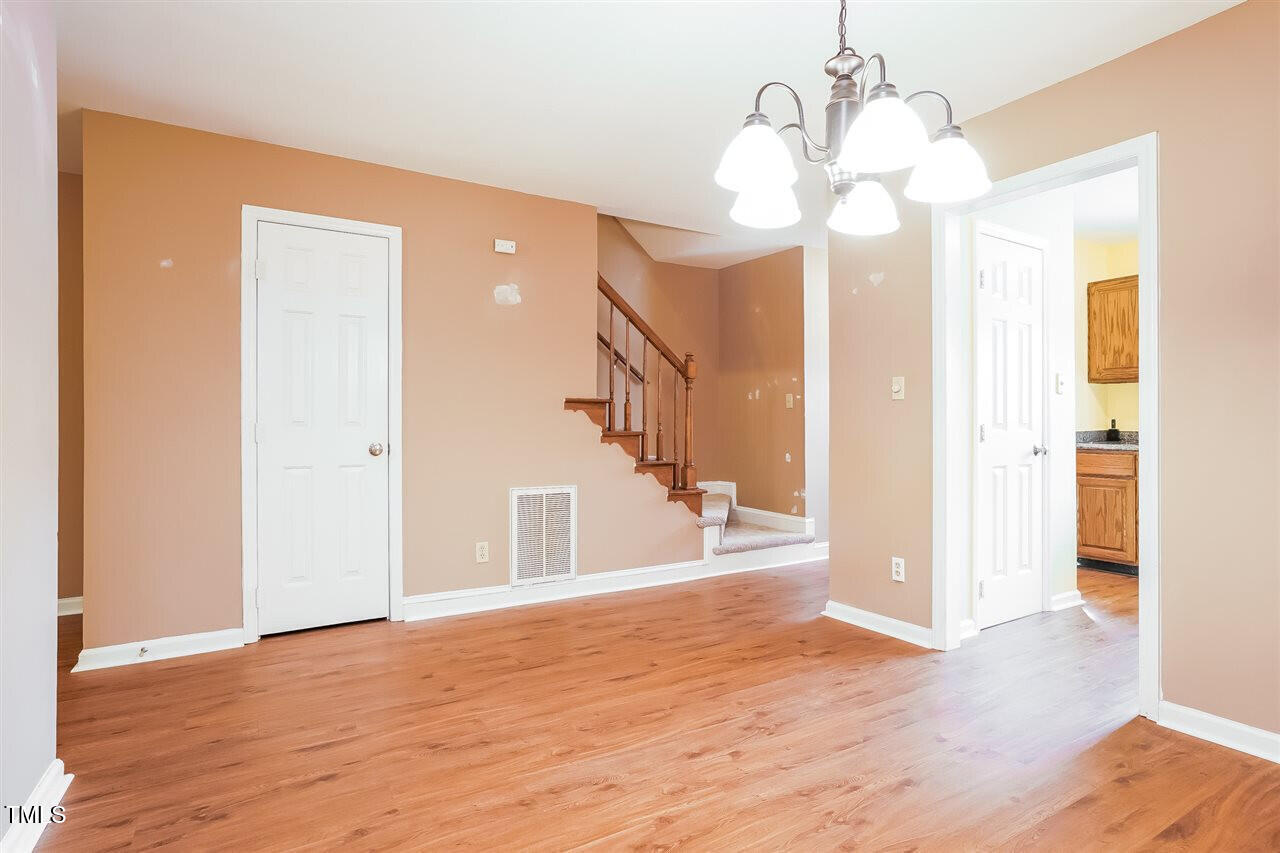 551 Oak Run Drive Raleigh, NC 27606 - Photo 3 of 13 a view of a livingroom with wooden floor