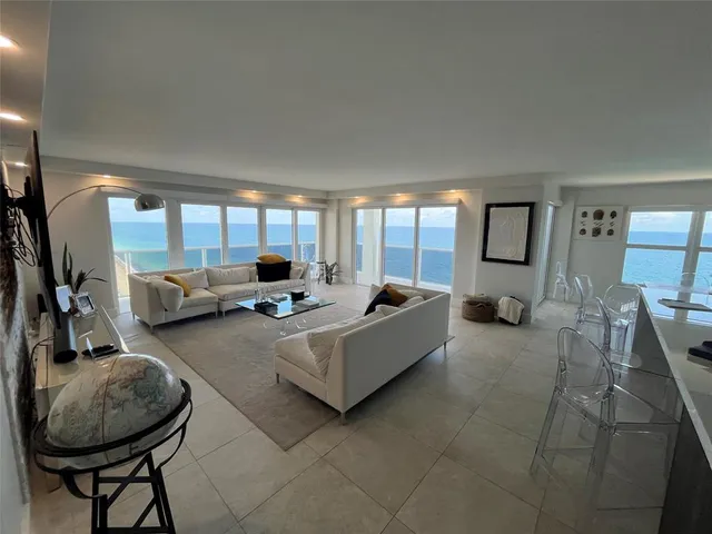 a kitchen with a refrigerator and a stove top oven