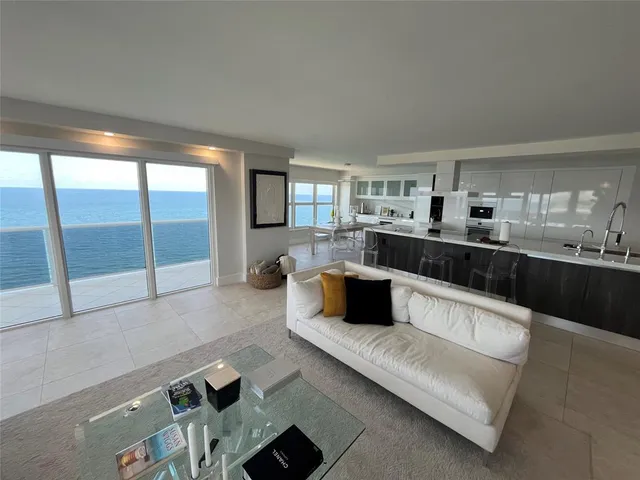 a stove top oven sitting inside of a kitchen