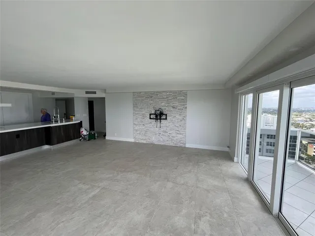 a kitchen with granite countertop a sink and a stove top oven