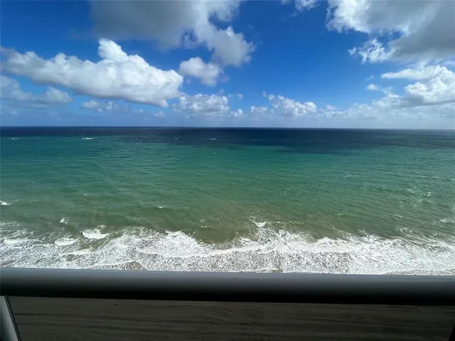 a view of a lake from a balcony