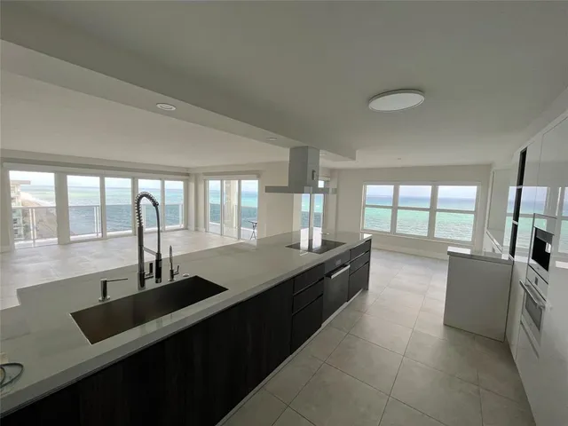 a bathroom with a sink mirror and shower