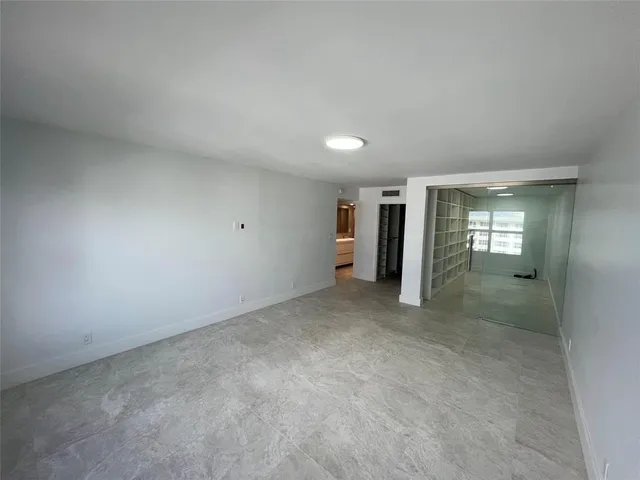 a view of a lake with a building in the background