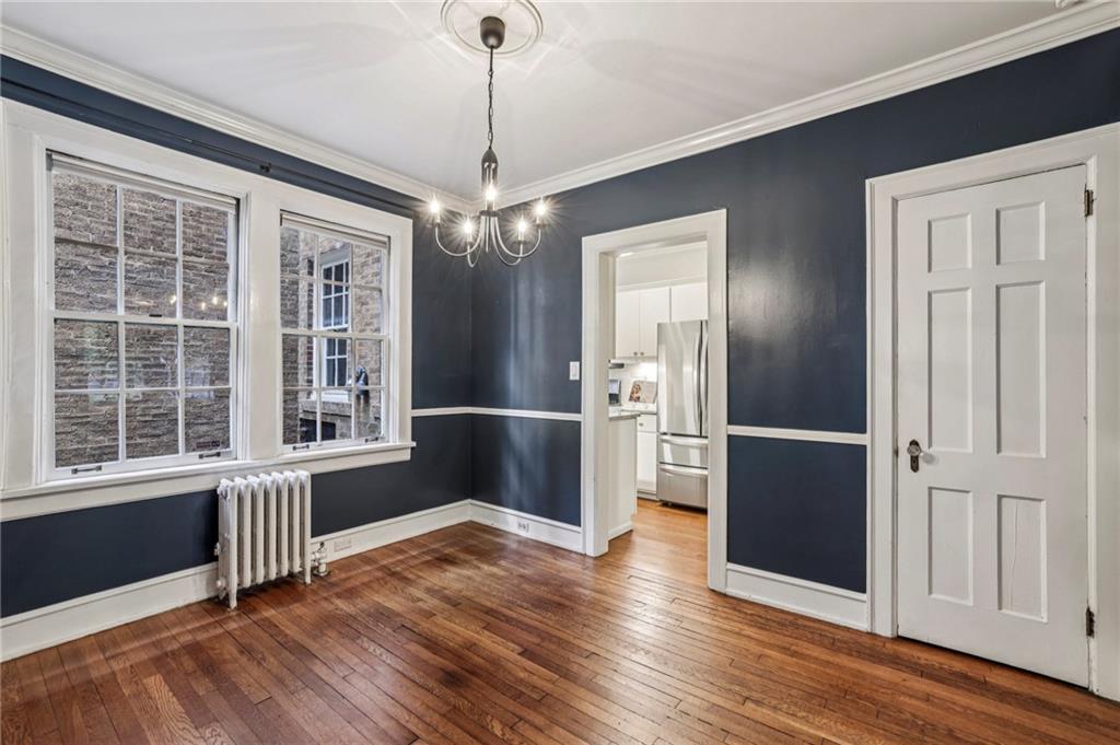 8 Collier Road Northwest, Unit A1 Atlanta, GA 30309 - Photo 13 of 31 a view of a big room with wooden floor chandeliers and kitchen