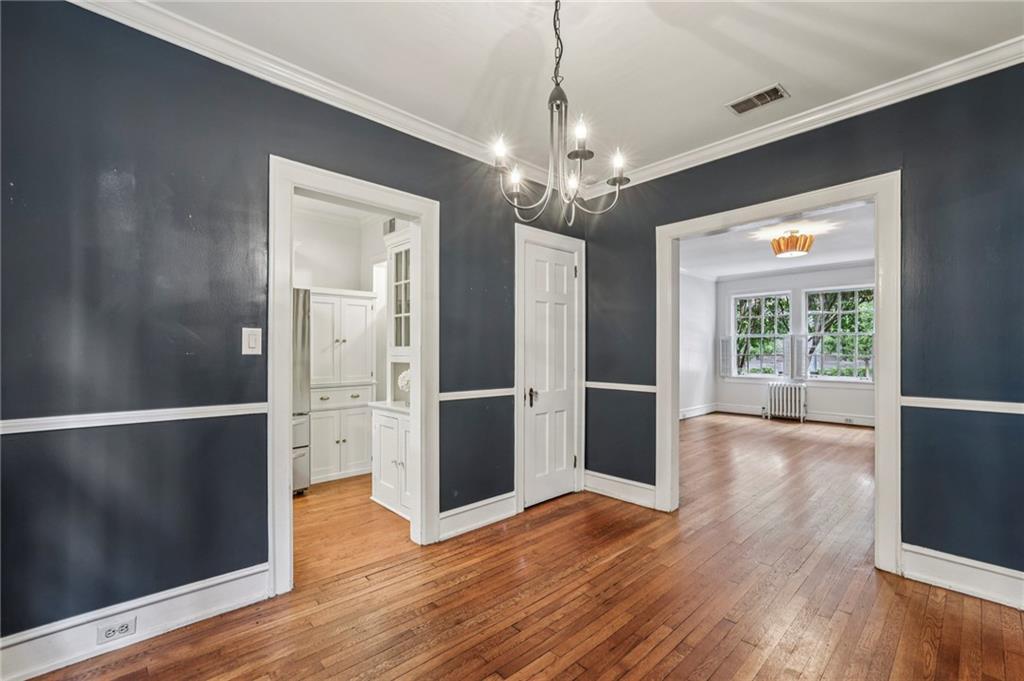 8 Collier Road Northwest, Unit A1 Atlanta, GA 30309 - Photo 14 of 31 a view of a room with wooden floor chandelier and windows