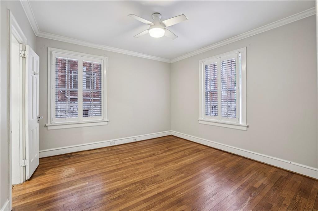 8 Collier Road Northwest, Unit A1 Atlanta, GA 30309 - Photo 18 of 31 a view of an empty room with wooden floor and a window
