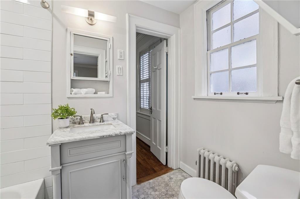 8 Collier Road Northwest, Unit A1 Atlanta, GA 30309 - Photo 20 of 31 a bathroom with a sink and a toilet
