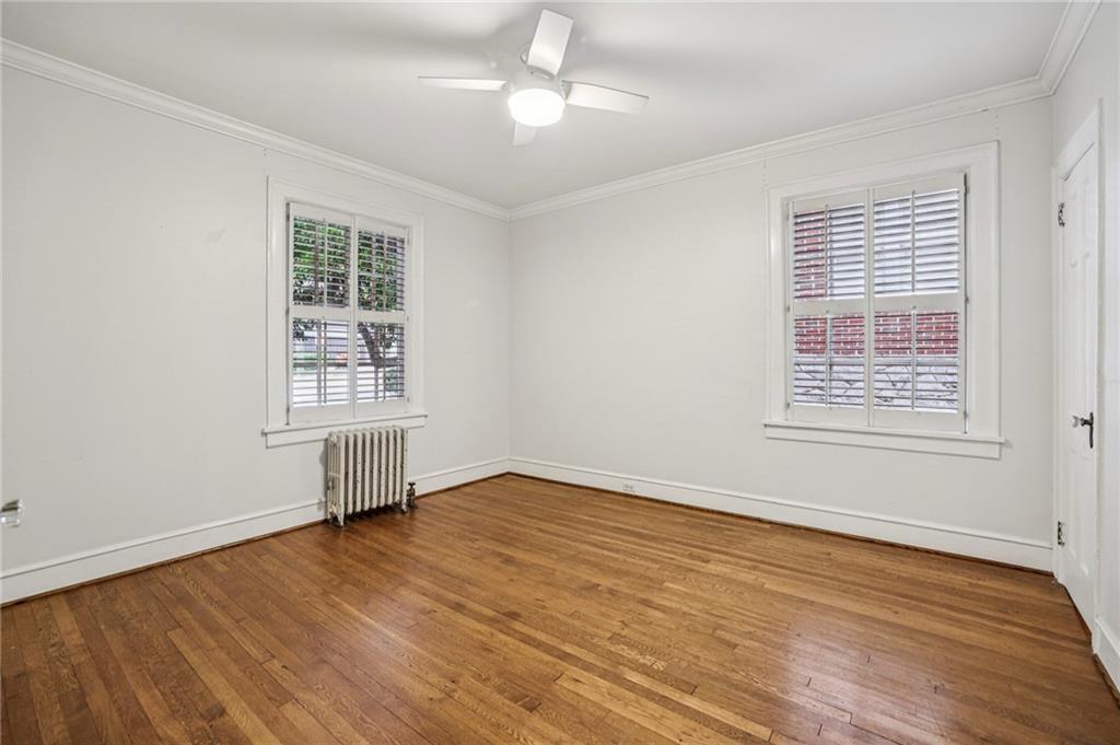8 Collier Road Northwest, Unit A1 Atlanta, GA 30309 - Photo 23 of 31 a view of an empty room with wooden floor and a window
