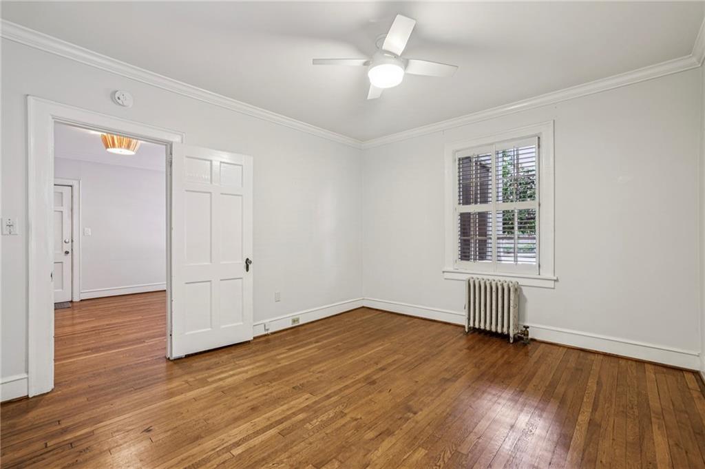 8 Collier Road Northwest, Unit A1 Atlanta, GA 30309 - Photo 25 of 31 wooden floor in an empty room with a window