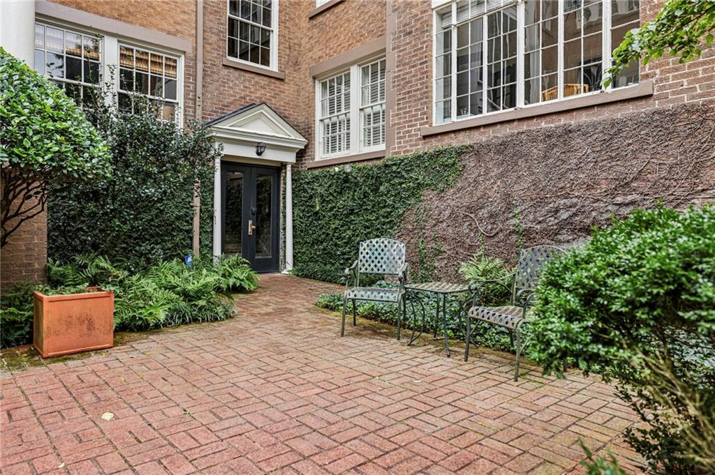 8 Collier Road Northwest, Unit A1 Atlanta, GA 30309 - Photo 26 of 31 a garden view with a seating space