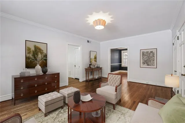 a living room with furniture and a table