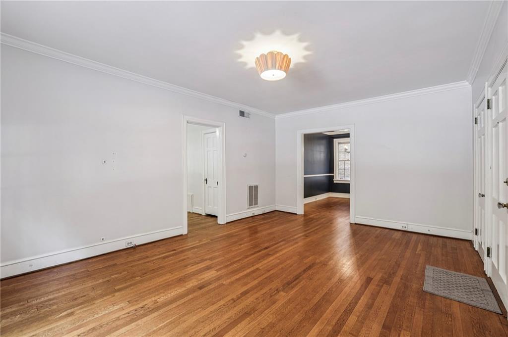 8 Collier Road Northwest, Unit A1 Atlanta, GA 30309 - Photo 6 of 31 a view of empty room with wooden floor