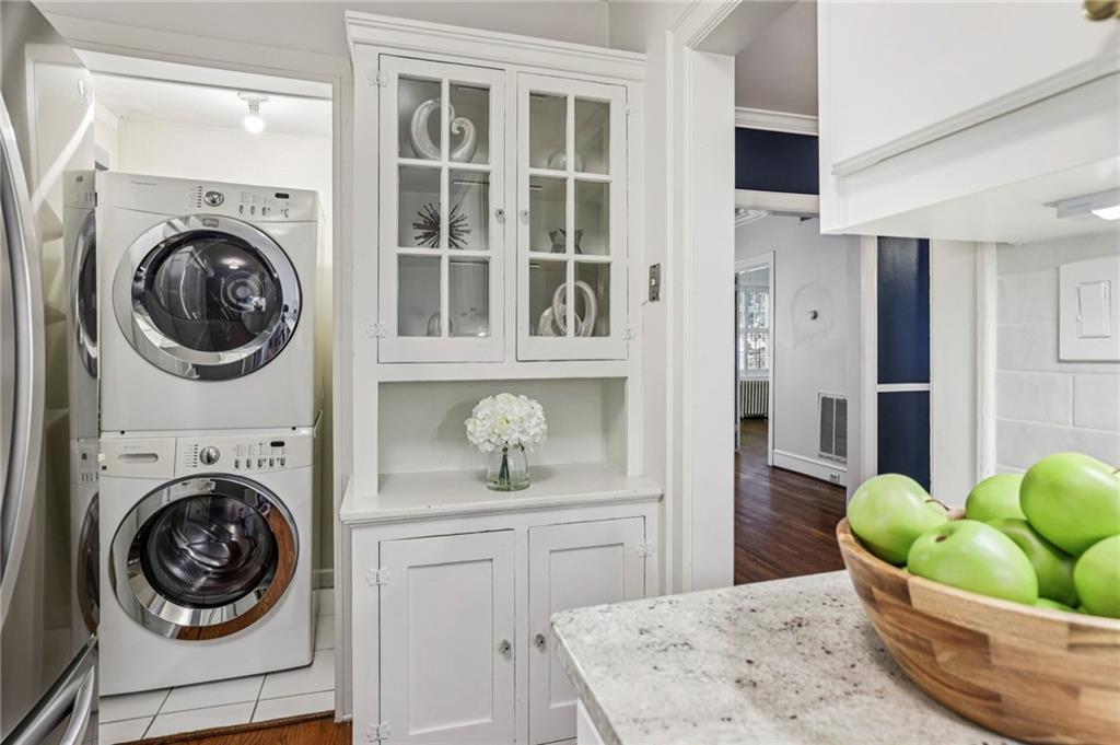8 Collier Road Northwest, Unit A1 Atlanta, GA 30309 - Photo 10 of 31 a view of a hallway with washer and dryer