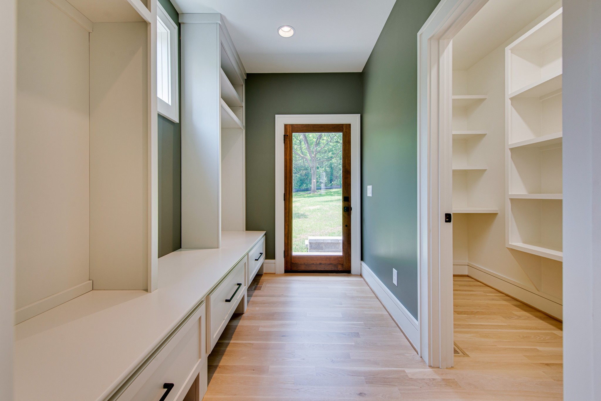 2111 Natchez Trace Nashville, TN 37212 - Photo 15 of 41 a view of a hallway with wooden floor and staircase