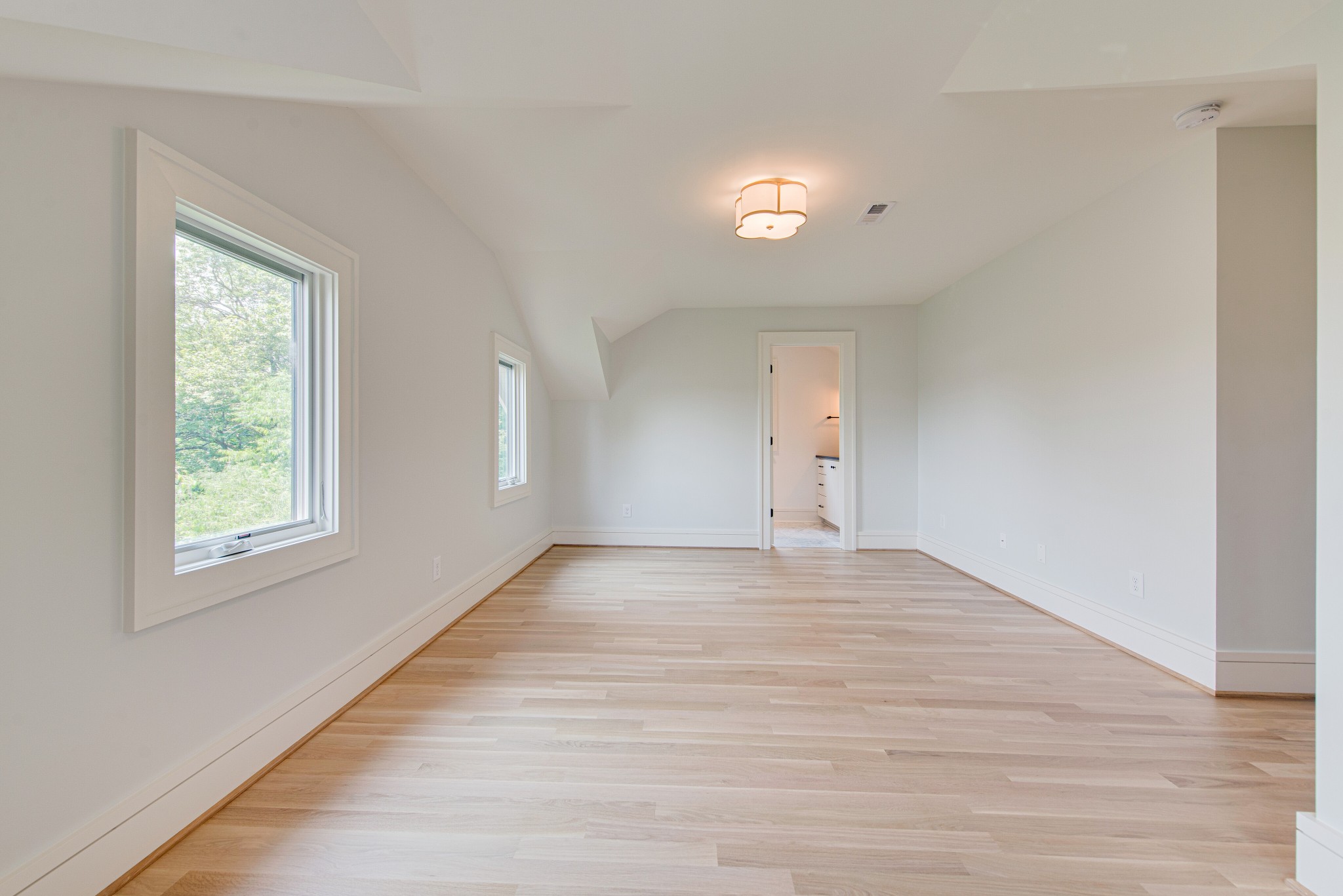 2111 Natchez Trace Nashville, TN 37212 - Photo 24 of 41 an empty room with wooden floor and windows