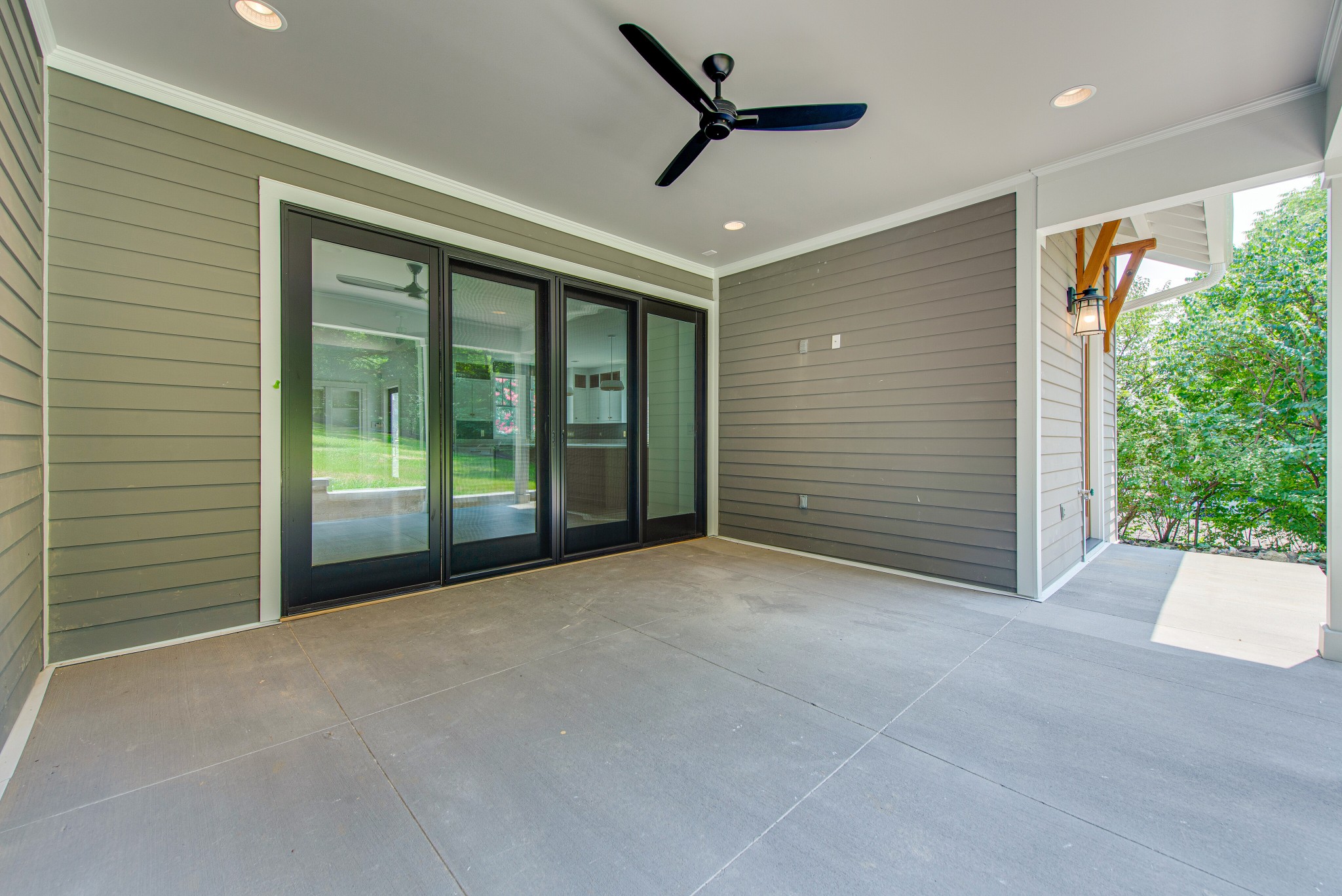 2111 Natchez Trace Nashville, TN 37212 - Photo 33 of 41 a view of an empty room with a sliding door and wooden floor