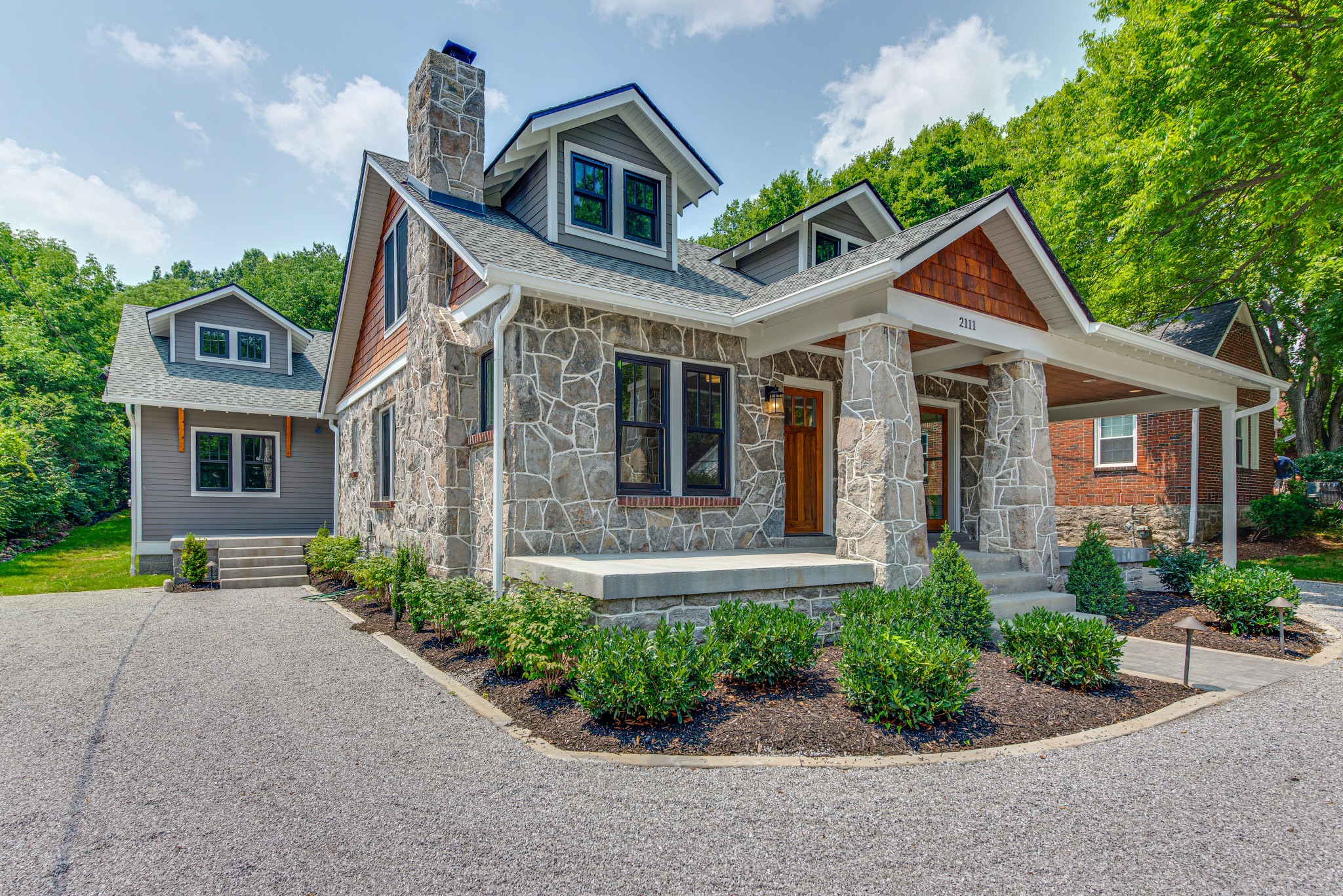 2111 Natchez Trace Nashville, TN 37212 - Photo 4 of 41 a front view of a house with a yard and potted plants