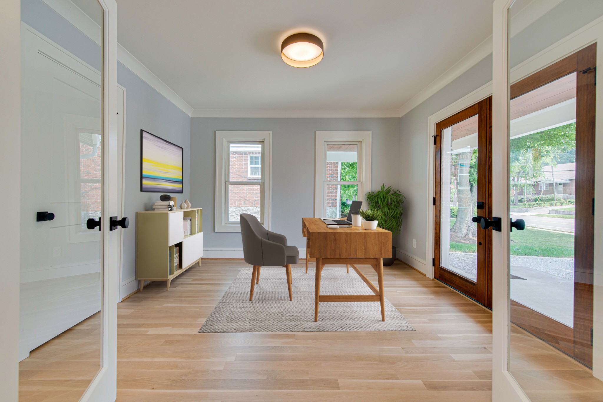 2111 Natchez Trace Nashville, TN 37212 - Photo 6 of 41 a view of a livingroom with furniture wooden floor and front door