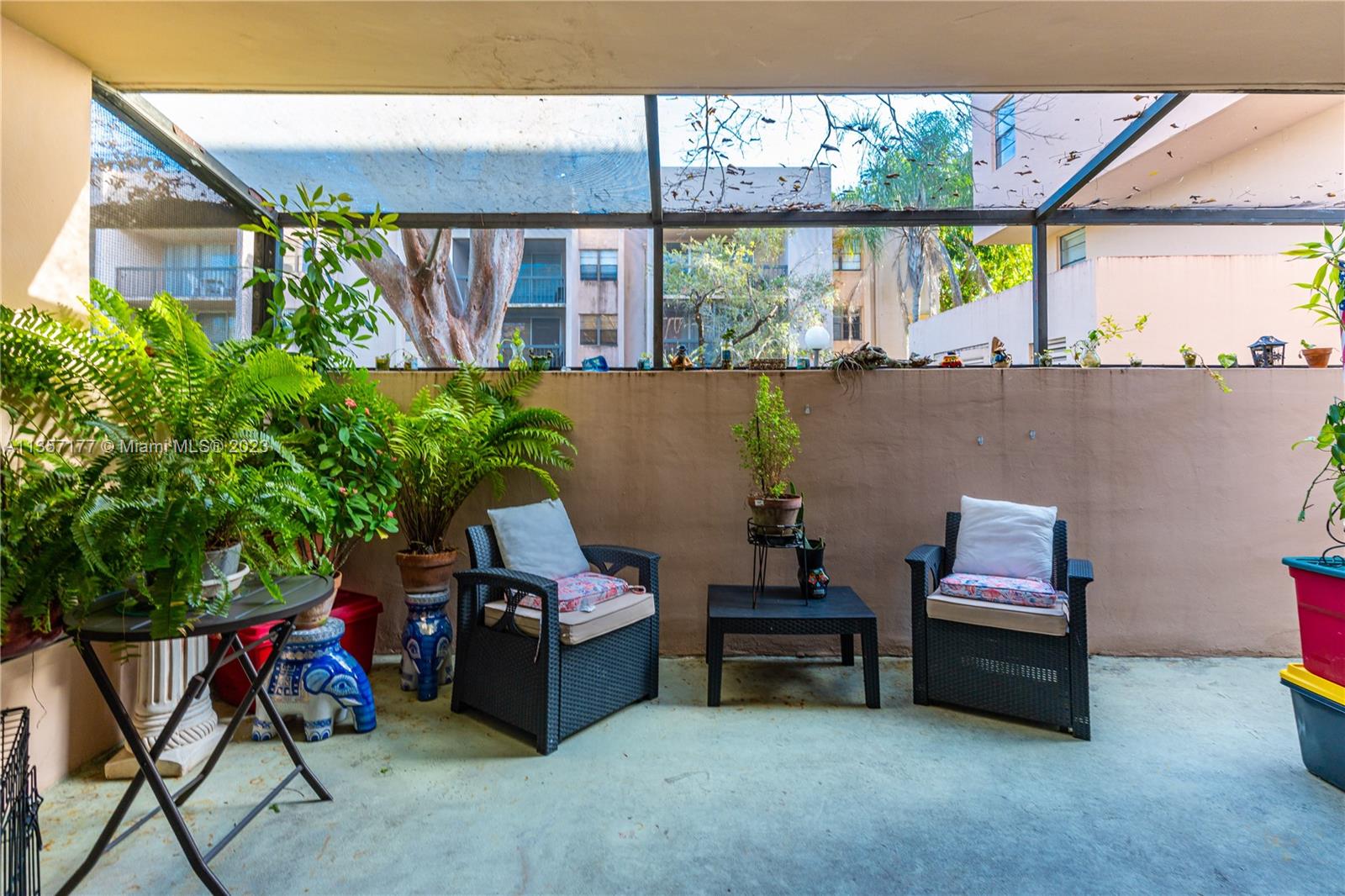 Kendall Miami, FL 33176 - Photo 22 of 35 a outdoor living space with furniture and a potted plant