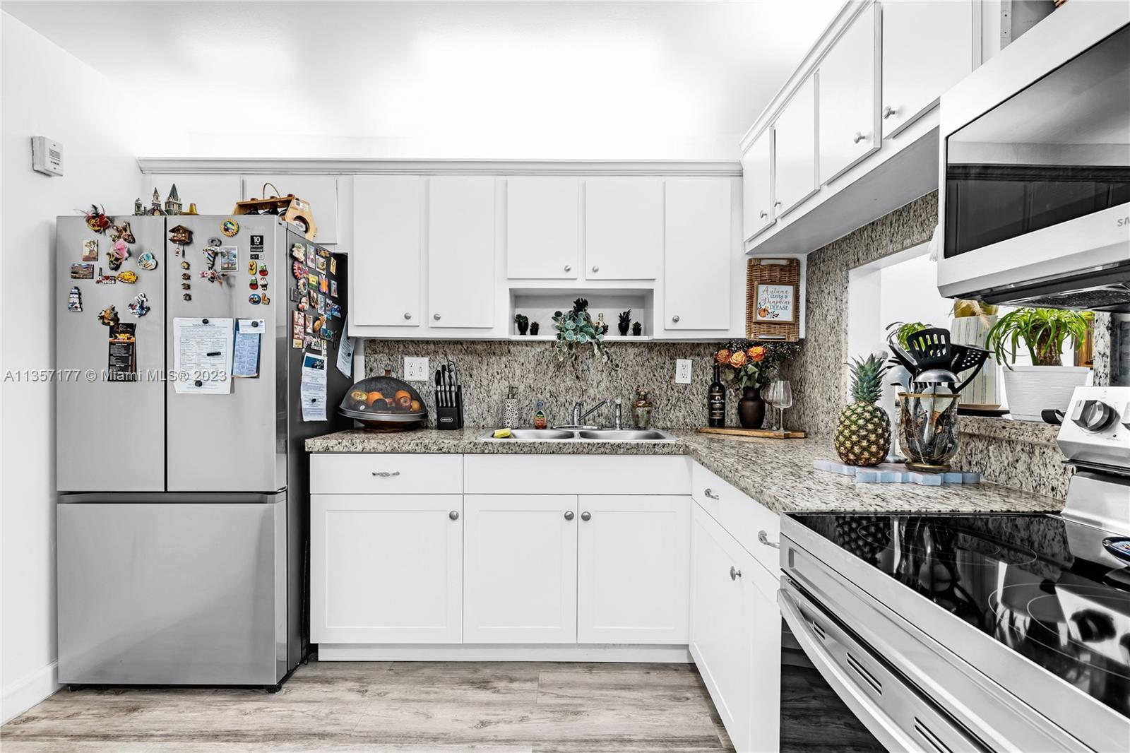 Kendall Miami, FL 33176 - Photo 8 of 35 a kitchen with stainless steel appliances granite countertop a refrigerator sink and cabinets