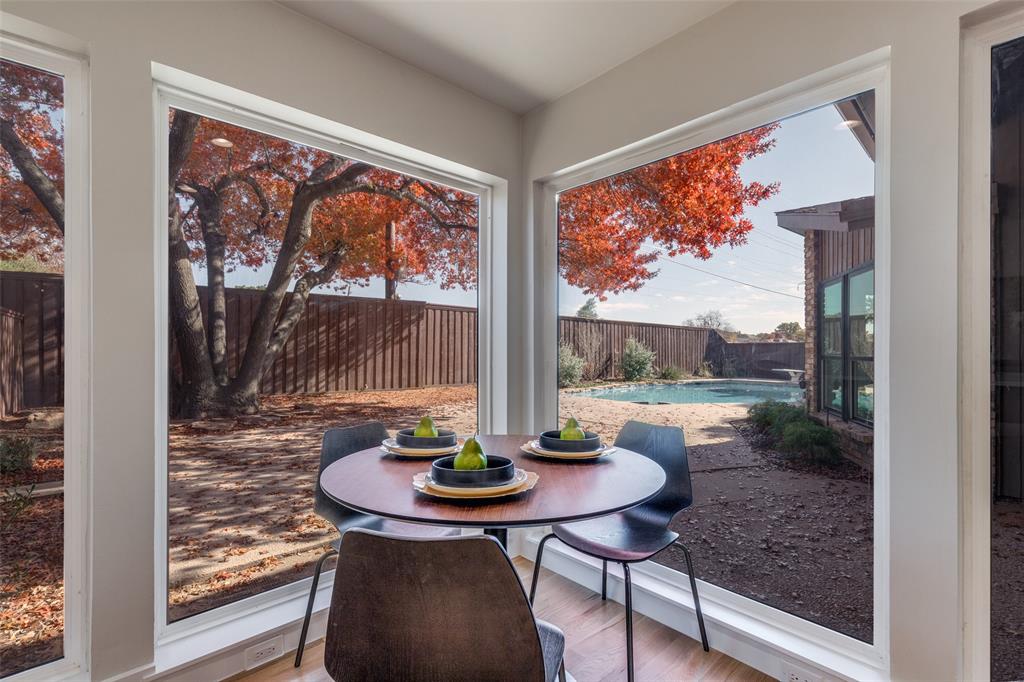 17119 Skelton Place Dallas, TX 75248 - Photo 16 of 32 a view of a dining room with a table and chairs