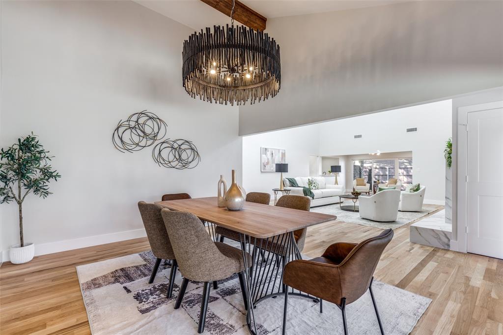17119 Skelton Place Dallas, TX 75248 - Photo 17 of 32 a view of a dining room with furniture and chandelier
