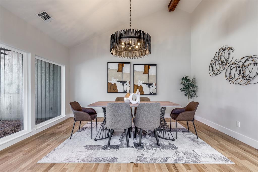17119 Skelton Place Dallas, TX 75248 - Photo 18 of 32 a view of a dining room with furniture window and wooden floor