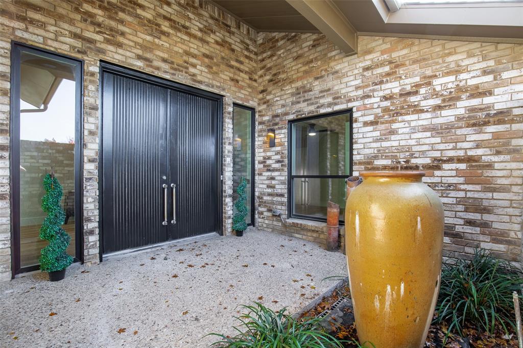 17119 Skelton Place Dallas, TX 75248 - Photo 2 of 32 a view of a entryway door of the house