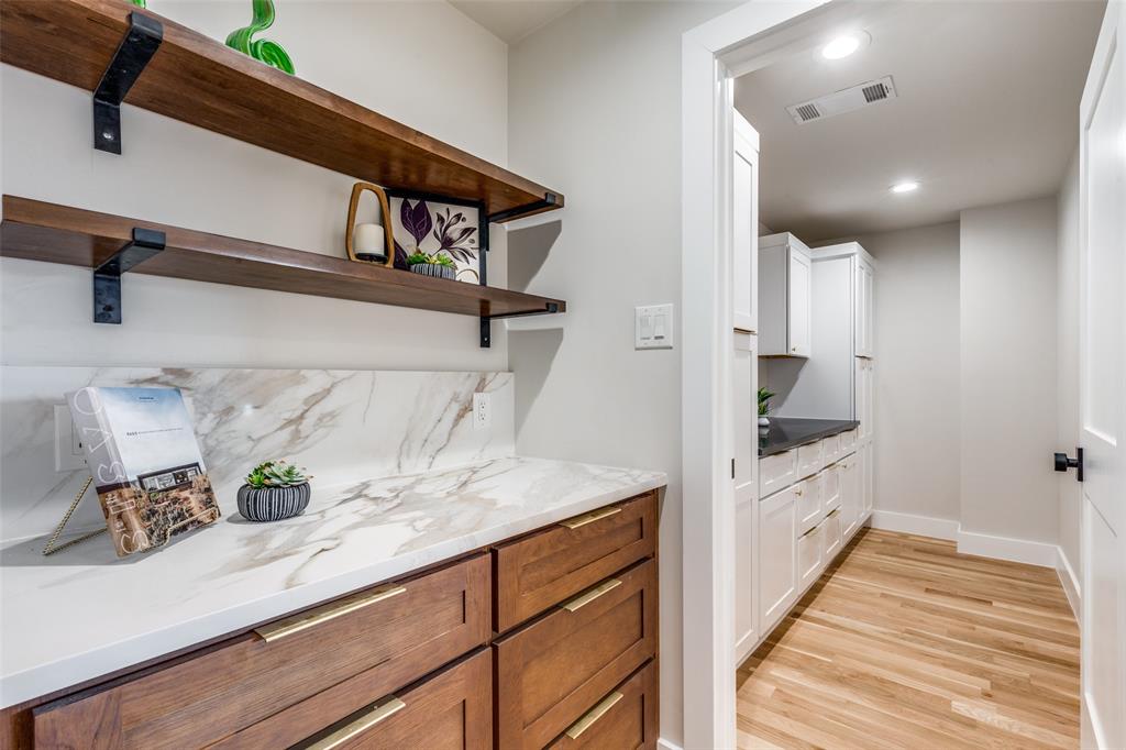 17119 Skelton Place Dallas, TX 75248 - Photo 27 of 32 a view of hallway with sink and wooden floor