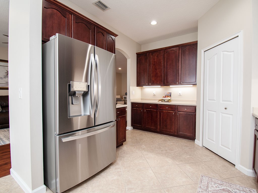 119 Amherst Lane Sebastian, FL 32958 - Photo 12 of 35 a kitchen with stainless steel appliances a refrigerator and a sink