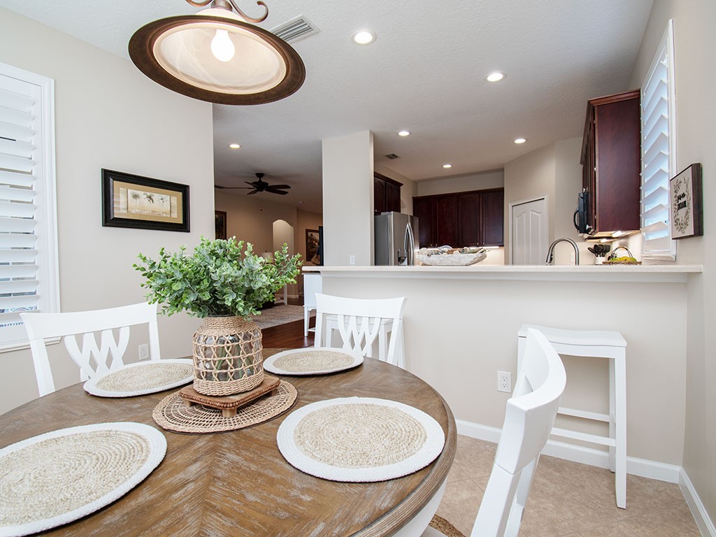 119 Amherst Lane Sebastian, FL 32958 - Photo 15 of 35 a kitchen with a table chairs and a dining table