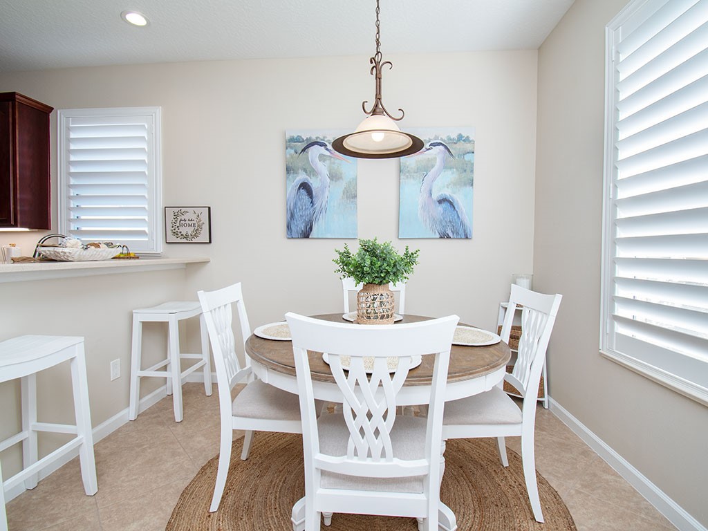 119 Amherst Lane Sebastian, FL 32958 - Photo 16 of 35 a view of a dining room with furniture and wooden floor