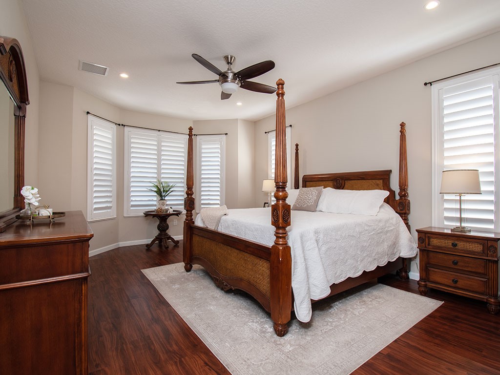119 Amherst Lane Sebastian, FL 32958 - Photo 18 of 35 a bedroom with a bed and wooden floor