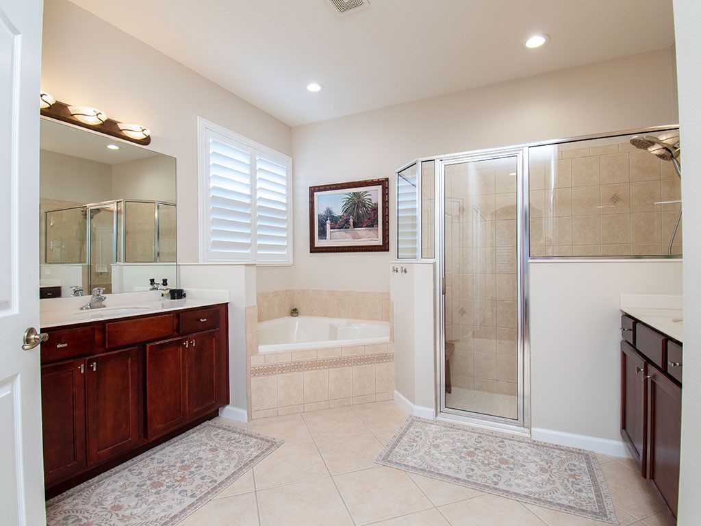 119 Amherst Lane Sebastian, FL 32958 - Photo 22 of 35 a spacious bathroom with a tub sink shower and mirror