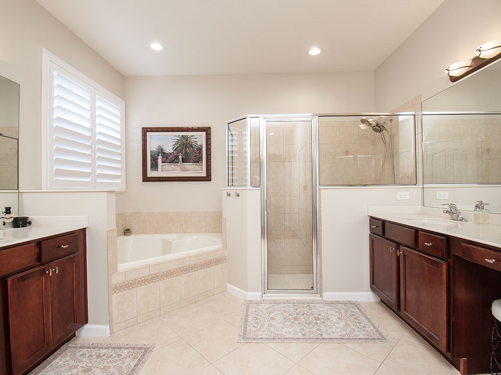 119 Amherst Lane Sebastian, FL 32958 - Photo 23 of 35 a spacious bathroom with a tub sink shower and mirror