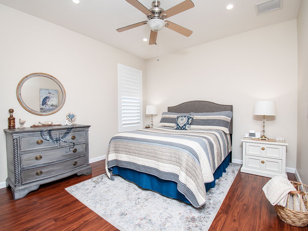 119 Amherst Lane Sebastian, FL 32958 - Photo 24 of 35 a bedroom with a bed and a dresser