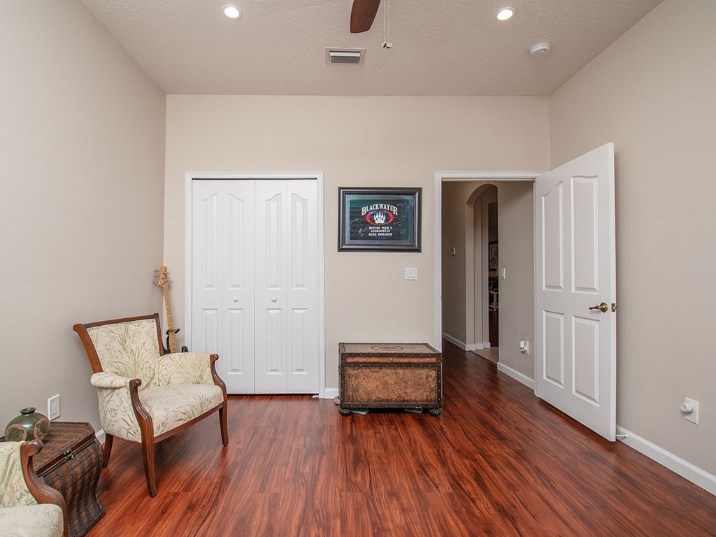 119 Amherst Lane Sebastian, FL 32958 - Photo 28 of 35 a living room with furniture and a wooden floor