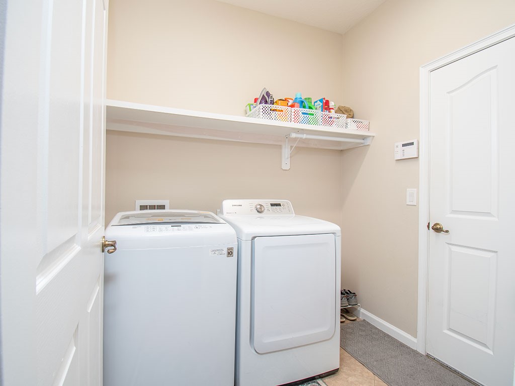 119 Amherst Lane Sebastian, FL 32958 - Photo 29 of 35 a utility room with dryer and washer