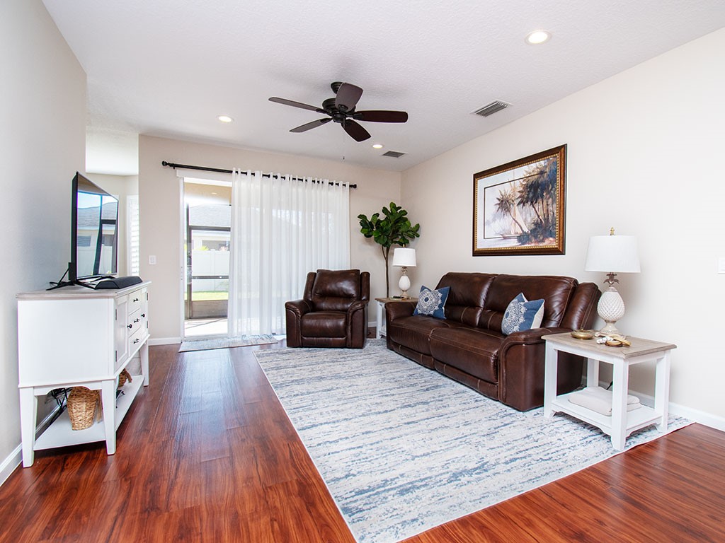 119 Amherst Lane Sebastian, FL 32958 - Photo 3 of 35 a living room with furniture and a wooden floor